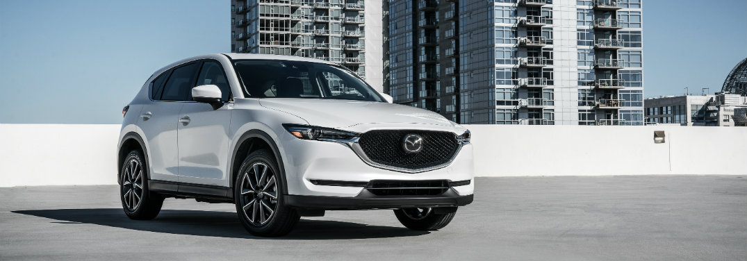 white mazda cx-5 parked on top of parking ramp