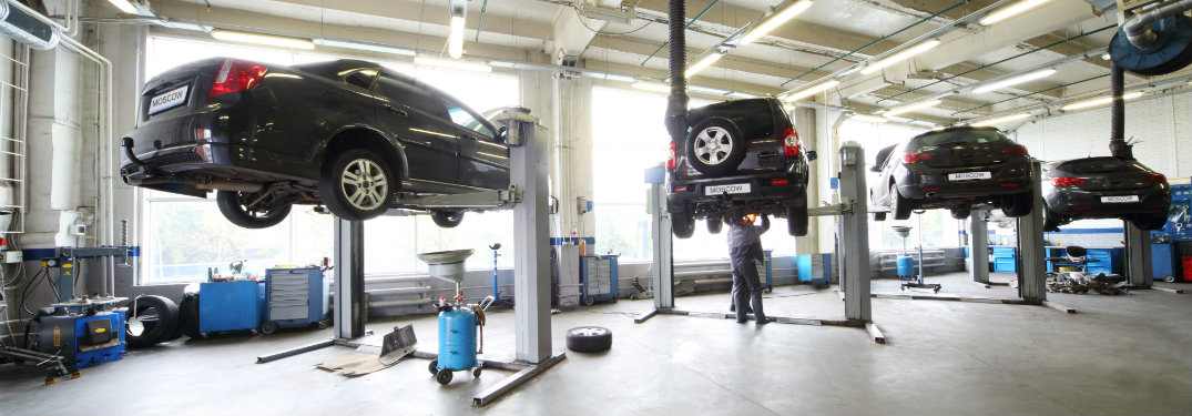 vehicles lifted in service shop