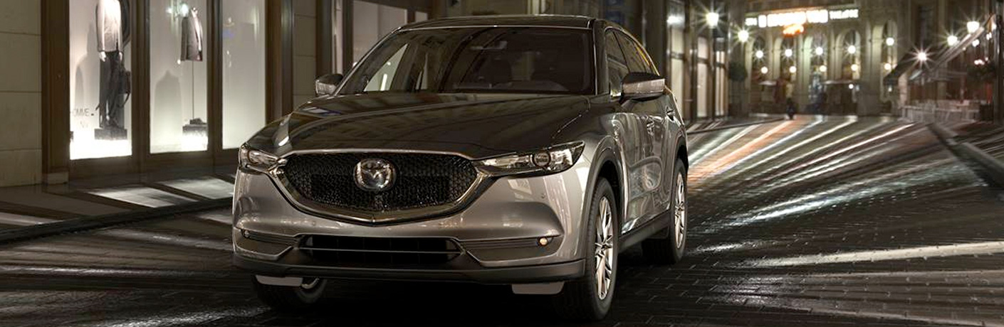 silver mazda cx-5 shining in the dark