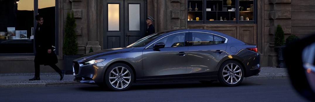 man walking by 2020 Mazda3