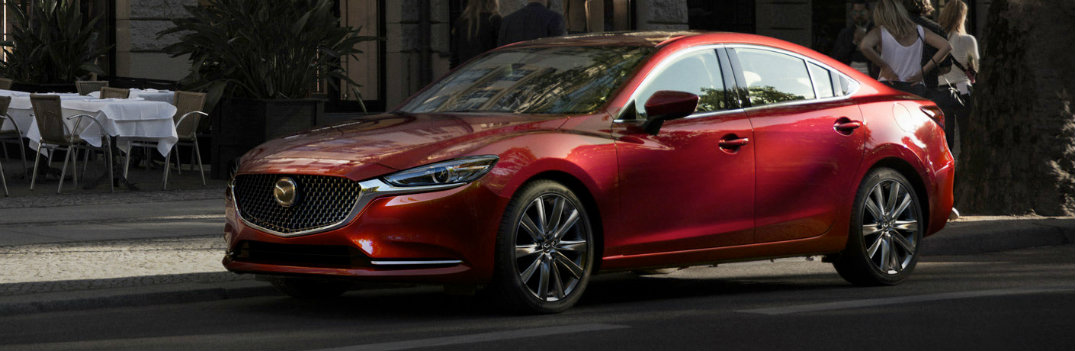 2018 Mazda6 red parked on a city street