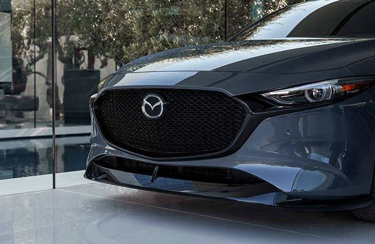 The front grille view of a gray 2021 Mazda3 Hatchback.