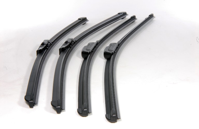 Two sets of windshield wiper blades against a white background.
