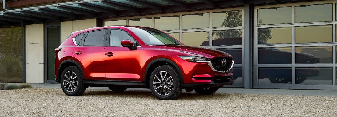 The side view of a red 2018 Mazda CX-5.