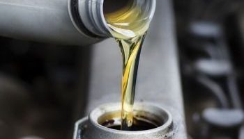 Engine oil being poured into vehicle