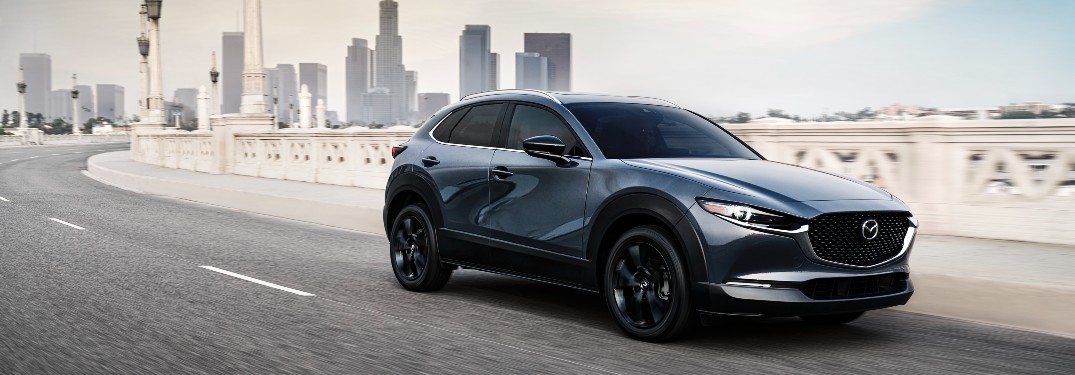 2021 Mazda CX-30 2.5 Turbo gray driving on curved bridge