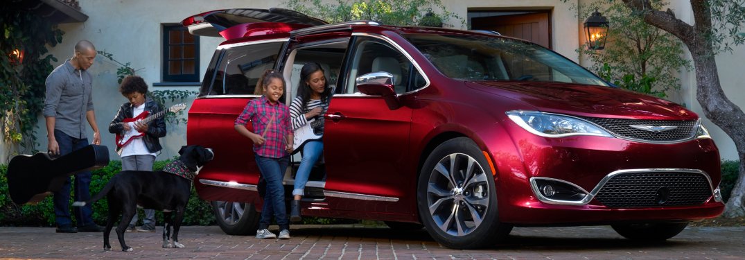 2019 Chrysler Pacifica red side view with family
