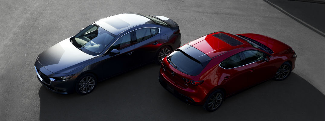 An overhead photo of the sedan and hatchback versions of the 2019 Mazda3.