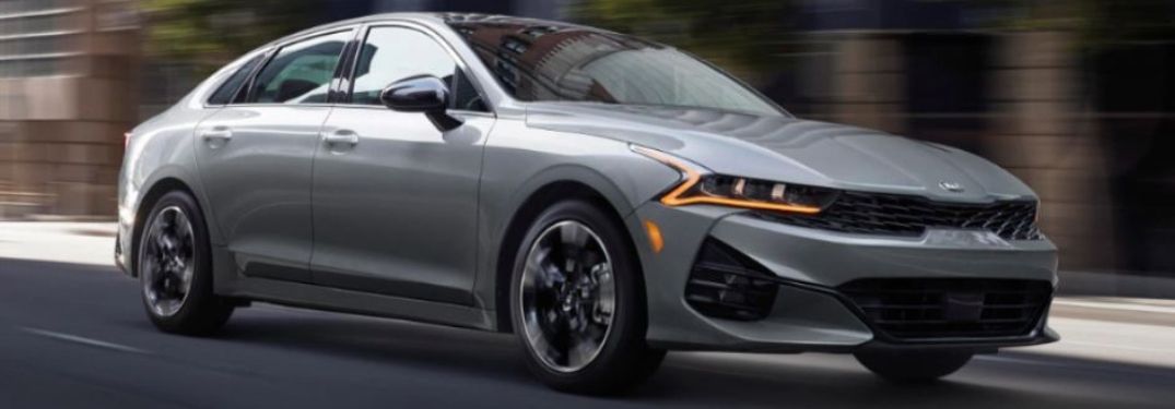 2021 Kia K5 Driving down a road