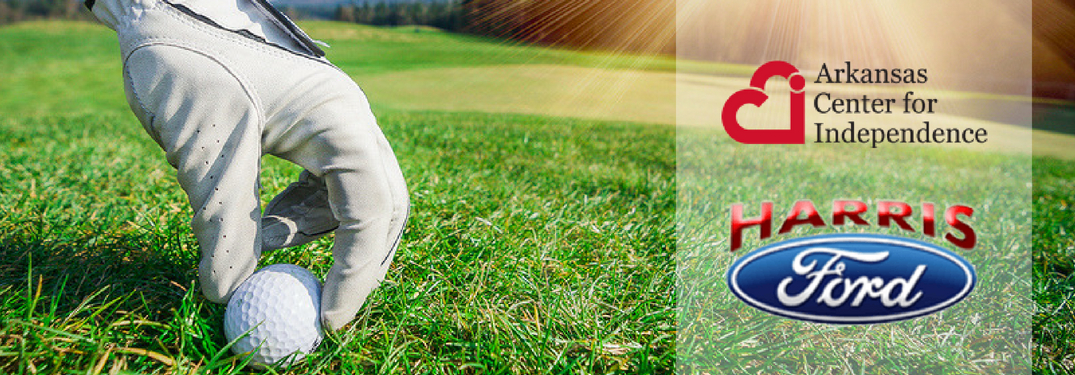 hand placing golf ball on fairway