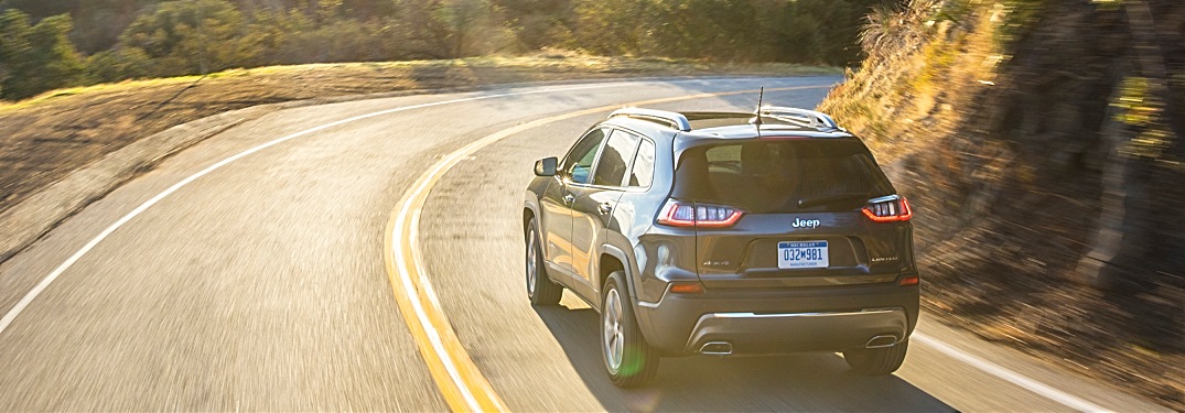2019 Jeep Cherokee black back view on the road