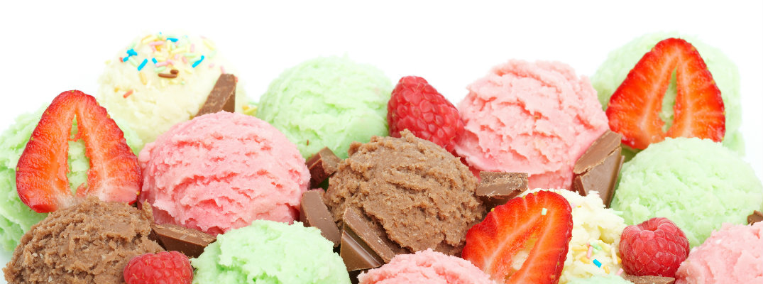 chocolate, mint, strawberry, and vanilla ice cream scoops topped with strawberries and sprinkles